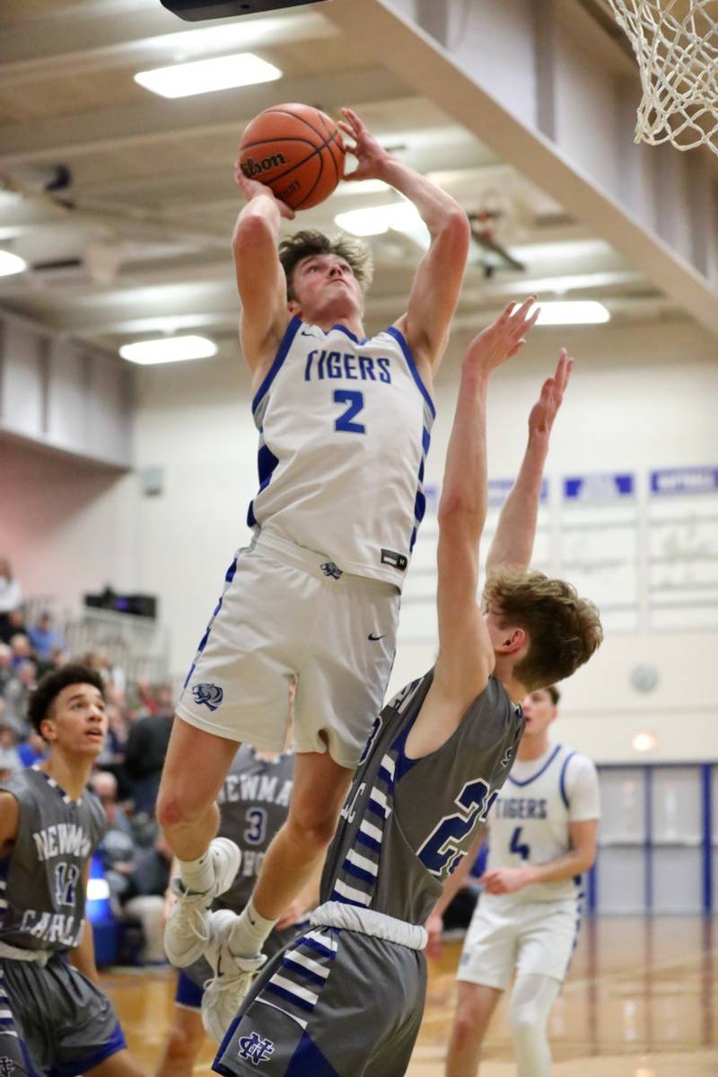 Princeton's Teegan Davis soars for a shot against Newman Friday night at Prouty Gym.