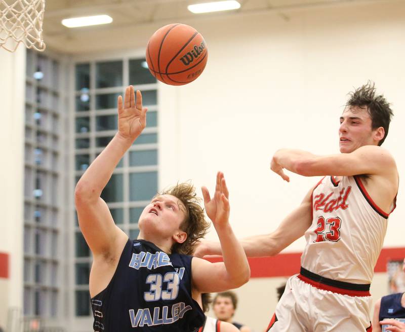 Bureau Valley's Elijah Endresss lets go of the ball as Hall's Braden Curran arrives late to the play on Tuesday, Feb. 6, 2024 at Hall High School.