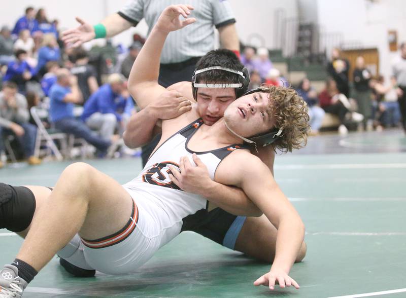 Marquette's Alex Schaefer wrestles Sandwich's Devon Blanchard in the 215 pound weight class during the Class 1A Regional meet on Saturday, Feb. 8, 2025 at St. Bede Academy.