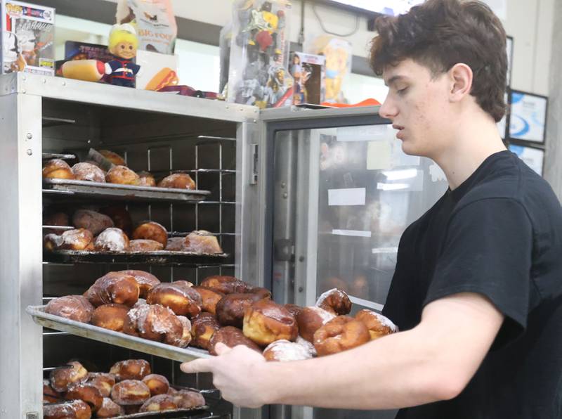 Kush Trim, pulls out a tray of Paczki's on Tuesday, Feb. 17, 2026 at Bobaluk's in Marseilles. Bobaluk's has been serving Paczki's for over 30 years. The restaurant makes hundreds of Paczkis every Fat Tuesday.