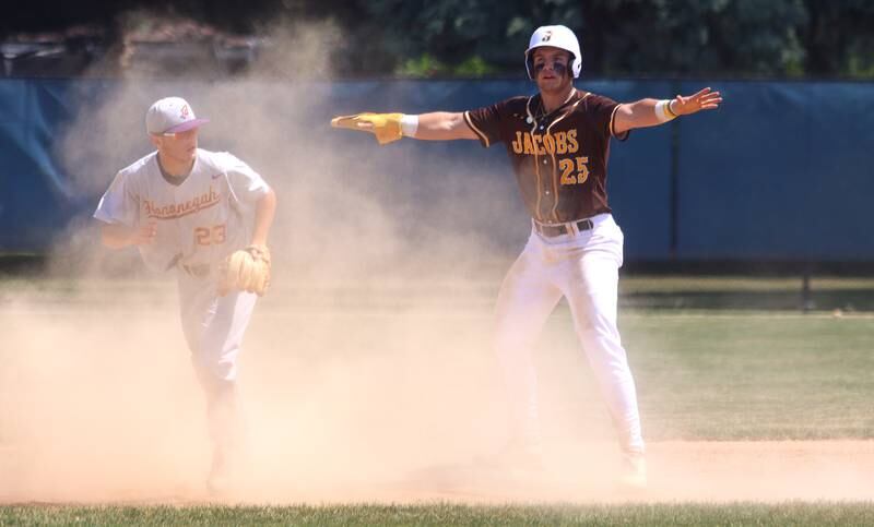 Hononegah’s Jakob Deleo emerges from the dust as Jacobs’ Christian Graves signals his safe arrival at second base in Class 4A Sectional baseball action at Carpentersville Saturday.