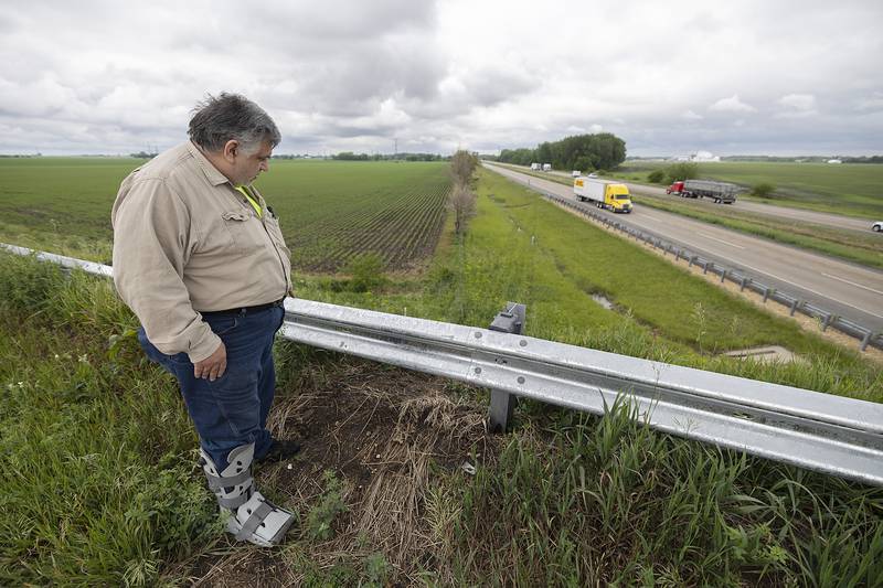 His first stop back at the scene of the accident, Eric Dodge looks over the repaired guardrail Wednesday, June 4, 2025, on Bollman Road. Tracks from his truck can still be seen from the February accident.