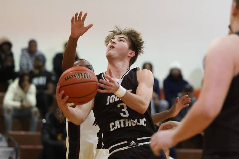Joliet Catholic’s Tyler Surin works for a layup against Prespectives in the Class 2A Julian Sectional championship on Friday, March 3rd, 2023 in Chicago.