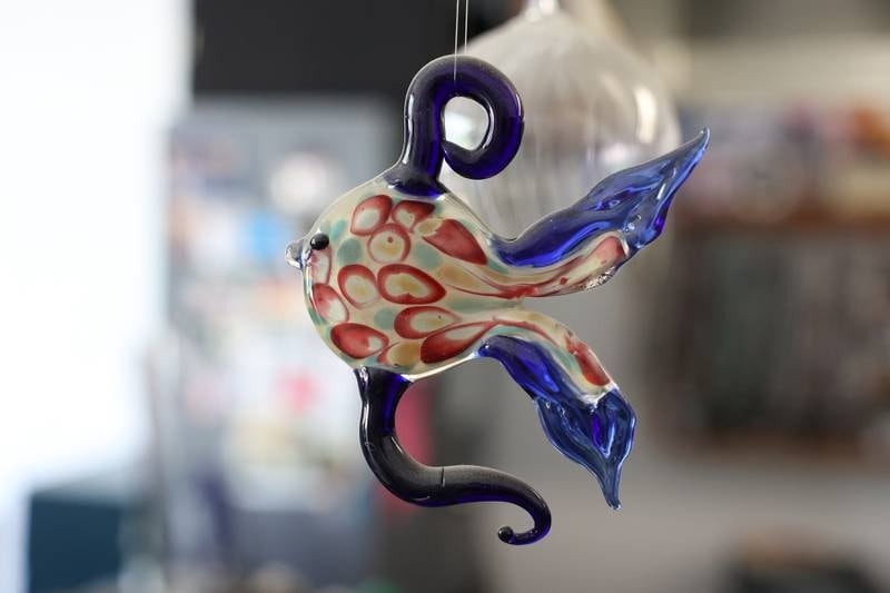 One of Angelica Cristal pieces of art hangs in her shop. Angelica is opening her own glass art business in the former Regis Glass Art Space in Downtown Joliet.