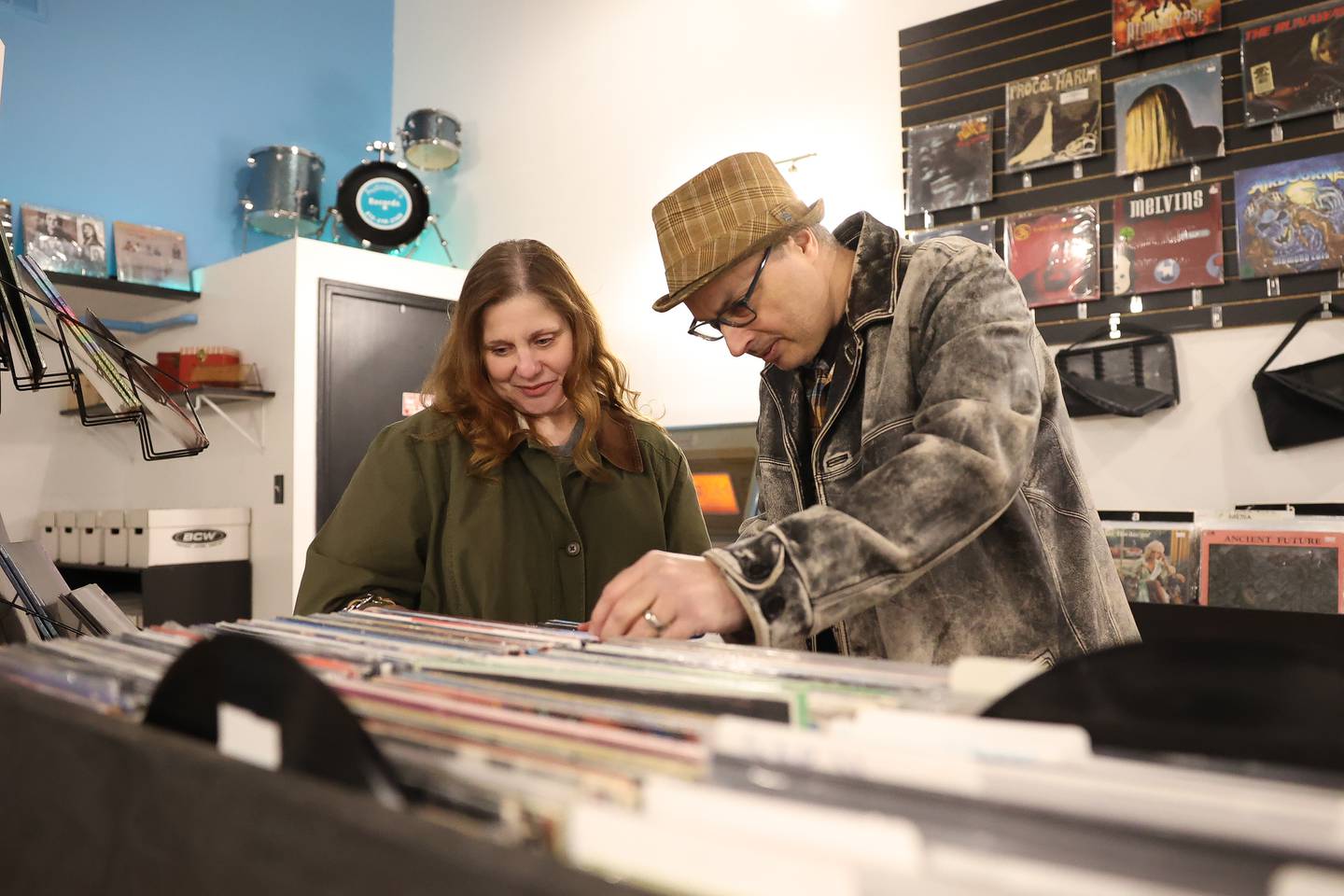 Liz Lanoue and her husband Matthew look through the vinyls at Audiophil’s Records’ new location opening day on National Record Store Day on Saturday, April 20, 2024 in Joliet.