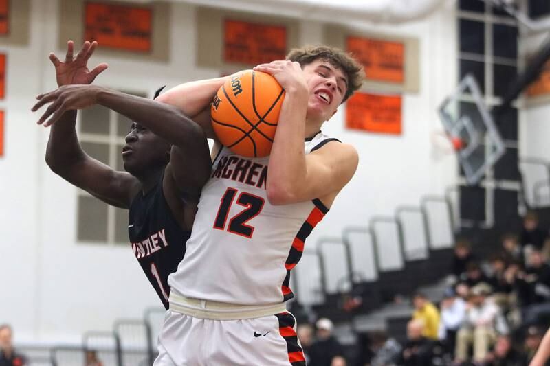 McHenry’s Caleb Jett, right, battles Huntley’s Sheldon Bonsu  for the ball in varsity boys basketball on Wednesday, Jan. 15, 2025, at McHenry High School in McHenry.