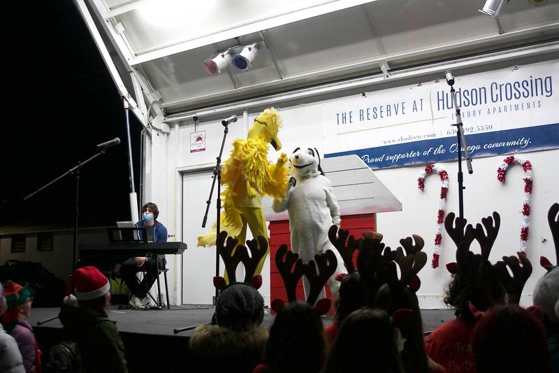 Snoopy and Woodstock danced on the stage during Oswego's Christmas tree lighting sketch Dec. 3, as part of the annual Christmas Walk celebration.