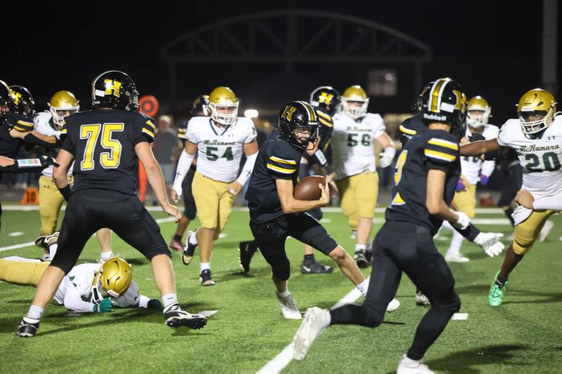 Herscher's Tanner Jones maneuvers through Bishop McNamara defenders during the Tigers 45-28 loss to the Fightin' Irish on Friday, Sept. 5, 2025.
