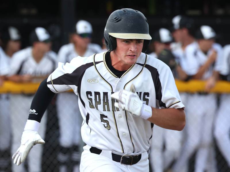 Sycamore's Tyler Lojko runs down the first base line during their Class 3A sectional semifinal against Wheaton Academy Wednesday, May 29, 2024, at the Sycamore Community Sports Complex.