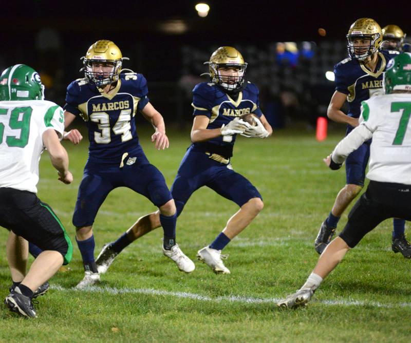 Polo's Mercer Mumford (1) runs for gain as Gage Zeigler (34) blocks against Alden-Hebron during 8-man playoff action on Friday, Nov. 1, 2024 in Polo.