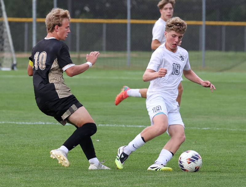 Kaneland's Isaac Stoltzner tries to work around Sycamore's Gavin Crouch during their game Monday, Oct. 6, 2025, at Sycamore High School.