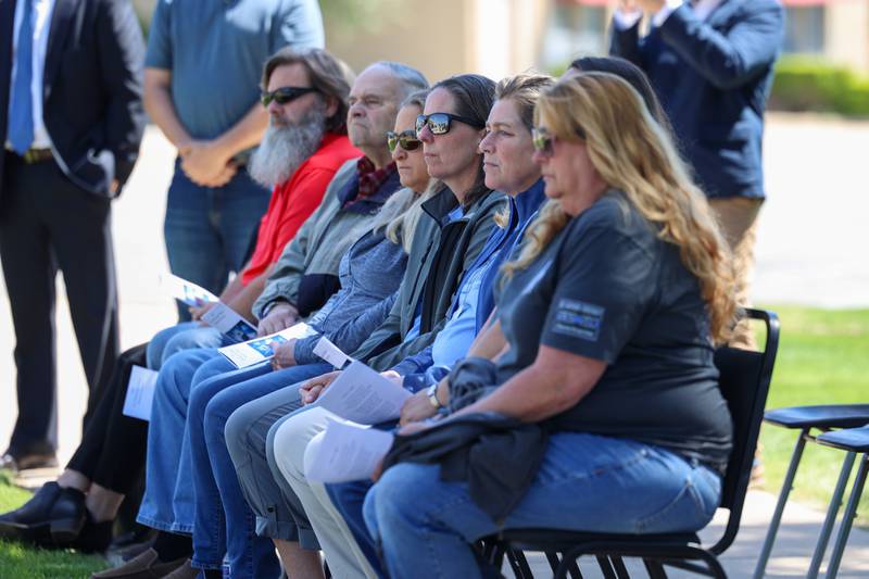 Family members and friends of fallen officers listen to the memorial address during the Kankakee County Law Enforcement Memorial on Thursday, May 14, 2026, at the Kankakee County Courthouse.