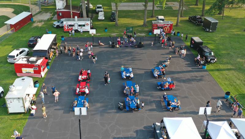 An aerial view of food trucks during the Friday Night Market's event on Friday, Aug. 18, 2023 at Kirby Park in Spring Valley. These well-loved markets, traditionally held on the third Friday of each month, moved from the downtown location in the mini park to the captivating and spacious Kirby Park. Fireworks concluded the event.