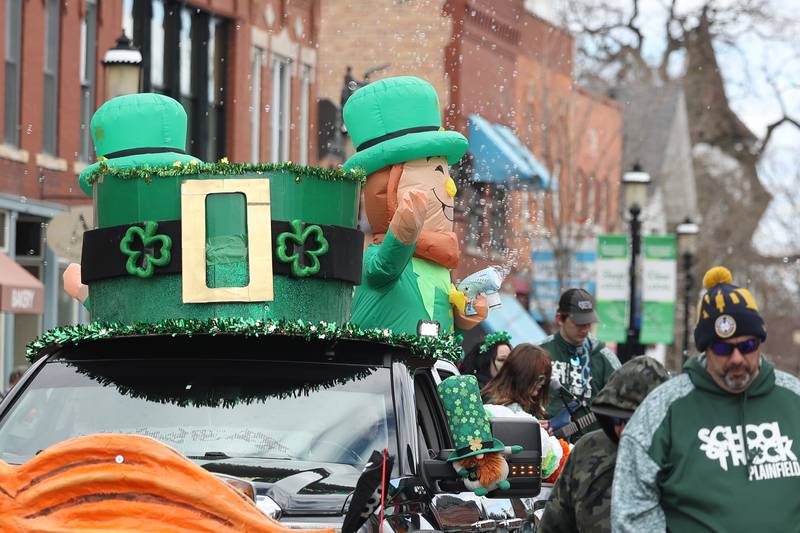 A leprechaun blows bubbles into the crowd in the Plainfield Hometown Irish Parade on Sunday, March 17, 2024 in Plainfield.