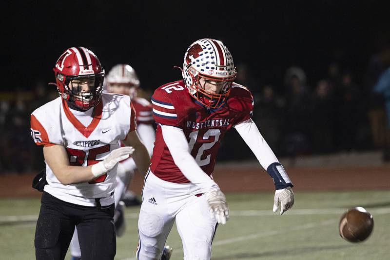 West Central’s Kaiden Droste swats down a pass in front of Amboy’s Brennan Blaine Friday, Nov. 18, 2022 in the 8-man championship football game.