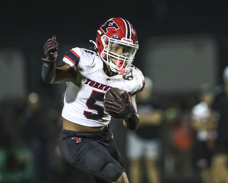 Yorkville's T.J. Harland (5) takes off downfield and is stopped at the one yard line during football game between Yorkville at Oswego Friday, Sept 26, 2025 in Oswego.