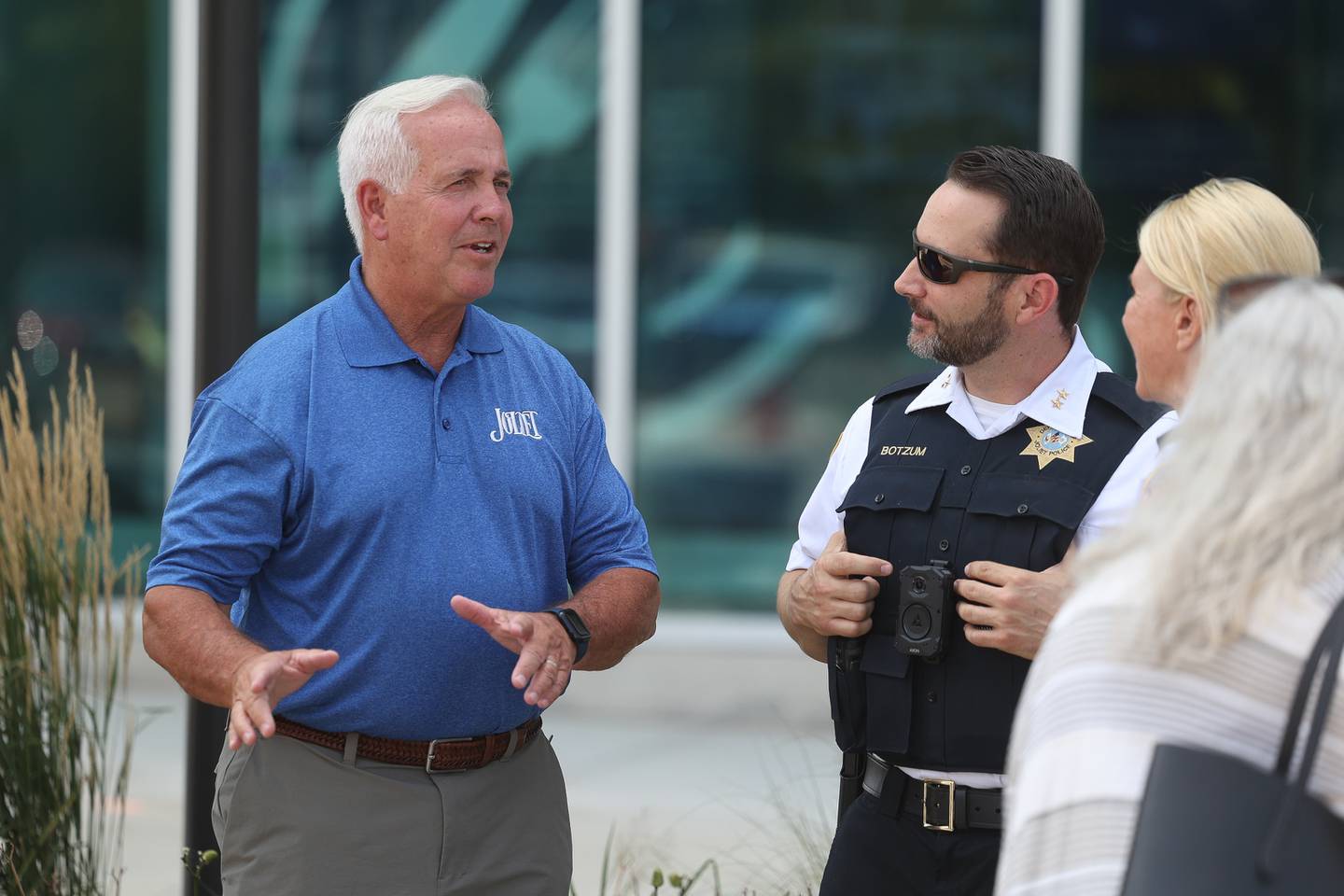 Joliet Mayor Terry D’Arcy, left, speaks Joliet Police Deputy Chief Christopher Botzum and Sherrie Blackburn at the Speed Catches Up With You speed awareness campaign on Tuesday, July 23, 2024 in Joliet.