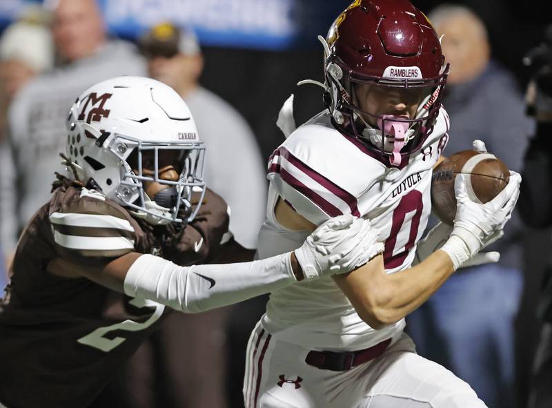 Loyola's Will Carlson (0) runs after making a catch during the varsity football game between Loyola Academy and Mt. Carmel high school on Friday, Oct. 25, 2024 in Chicago.