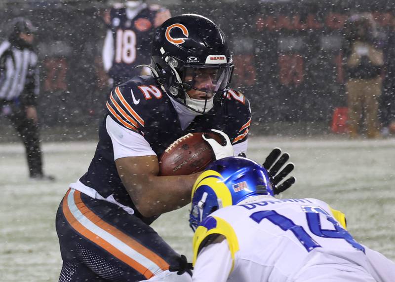 Chicago Bears wide receiver DJ Moore looks to get by Los Angeles Rams cornerback Cobie Durant Sunday, Jan. 18, 2026, during their NFC divisional playoff matchup at Soldier Field in Chicago.