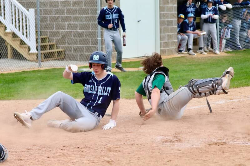 Bureau Valley's Brock Foster scores the game-tying run in the seventh inning on a sac fly by Sam Rouse. Foster had a key two-run triple.