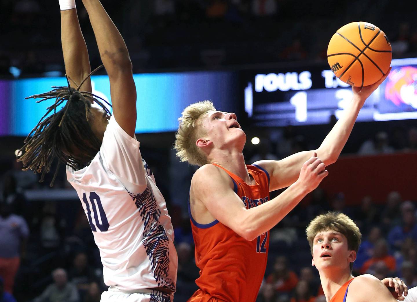 Eastland's Adam Awender gets a layup in front of Chicago Hope Academy's Trentyn McGinnis during their IHSA Class 1A state championship game Saturday, March 15, 2025, in the State Farm Center at the University of Illinois in Champaign.