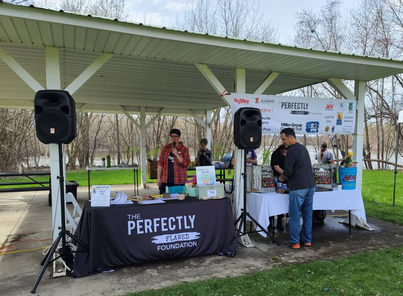 Natalie Martin, a volunteer with Perfectly Flawed Foundation, thanks people who attended the Earth Day Cleanup on Saturday. Twelve miles of walkway along the Illinois-Michigan Canal starting at the Lock 14 Shelter near La Salle were spruced up.