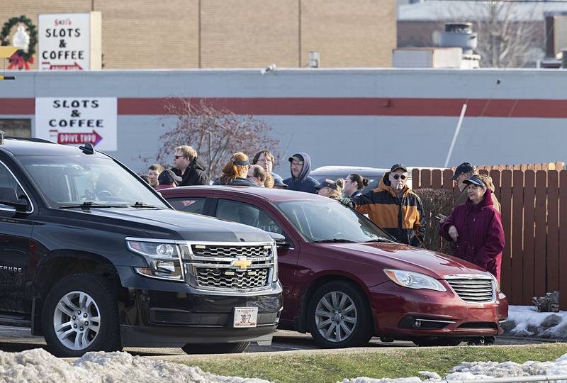 Workers gather outside of McDonald's in Dixon on Tuesday, Dec. 23, 2025, after a fire broke out in the hood of the grill. The restaurant is expected to be closed Wednesday. No one was injured.