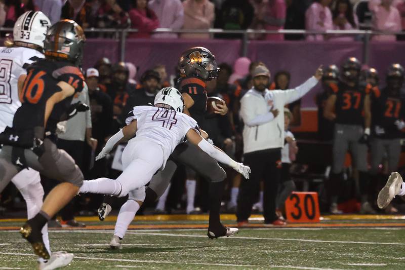 Minooka’s Gavin Dooley breaks away for the long touchdown run against Plainfield North. Friday, Oct. 7, 2022, in Minooka.