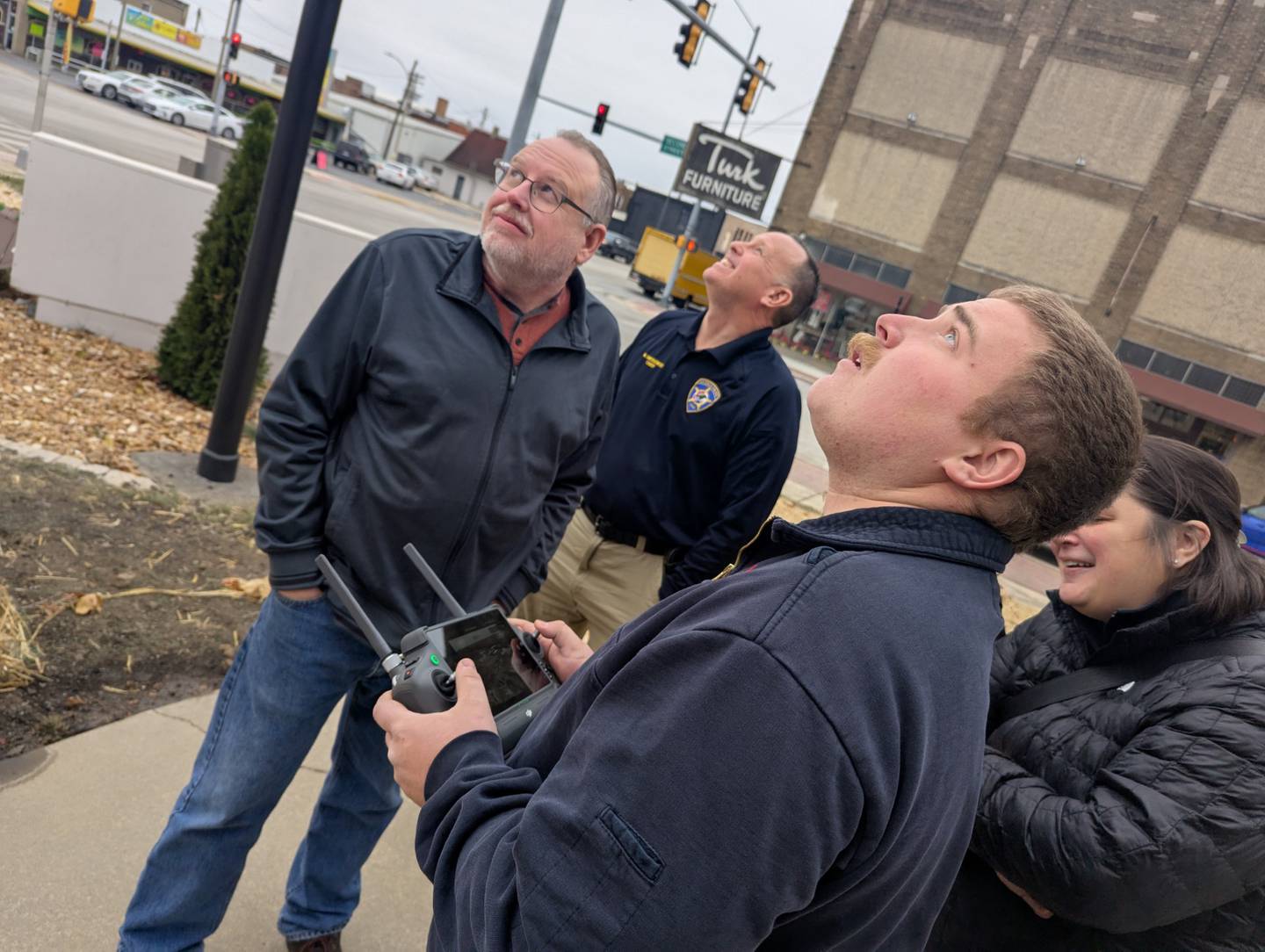 Shawn Mages of Illinois Cement (from left) and Police Chief Mike Smudzinski track the City’s new drone during a demonstration as La Salle Fire Department Engineer/EMT Hunter Thurman pilots from the ground near the La Salle Police Department. The departments received donations from the local business community towards the purchase.