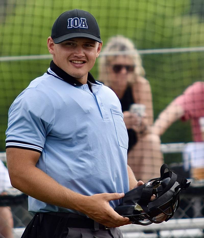 Louis Johnson, of Minooka, works a game from behind the plate.