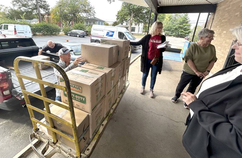 Volunteers from the Evangelical Free Church of Mt. Morris delivered 12 boxes filled with care packages for sailors on the USS Fitzgerald  to the Mt. Morris Post Office on Thursday, Oct. 16, 2025.