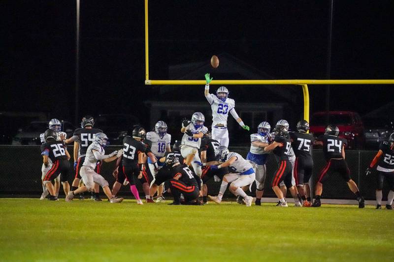 Sandwich’s Nate Hill (23) kicks an extra point against Woodstock during a football game at Sandwich High School on Friday, Oct. 11, 2024.