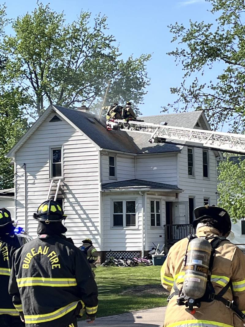Firefighters work the scene of a house fire in the 800 block of North Mercer Street on Wednesday, April 22, 2026 in Princeton.