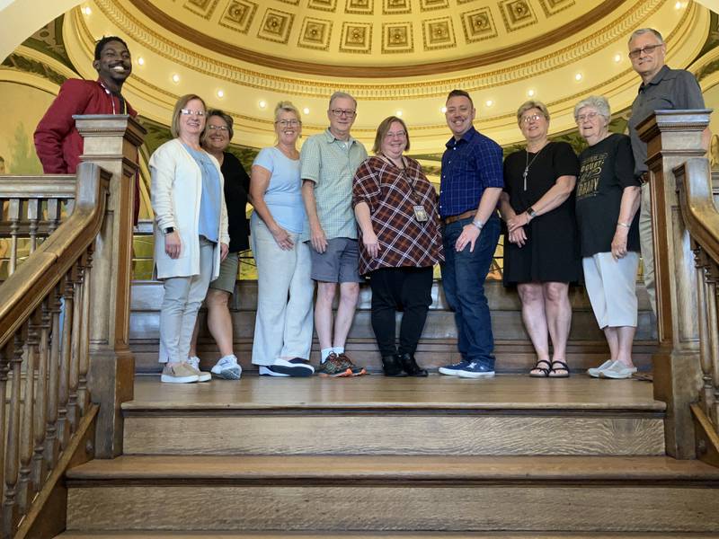 From left: Nadler Petit-Dieu (staff member), Ellen Vogel (Board vice president), Gail Russell (retired Board trustee), Sandy Austin (Board trustee), David Reed (Board president), Melissa Badger (library director), Jack Schuler (Board trustee), Darcy Mollo (Board trustee), Jane Farero (Board secretary), and Gary Wheeler (Board trustee).