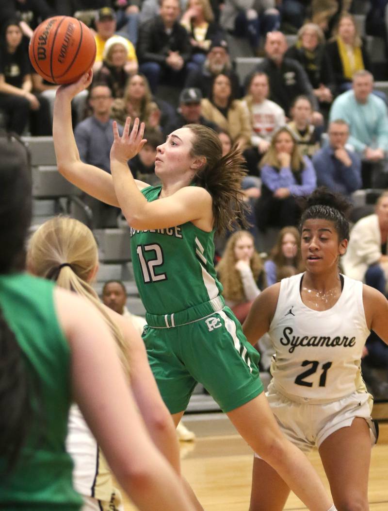 Providence Catholic's Laurelei Thormeyer shoots in front of Sycamore's Jakiya Thompson during their game Tuesday, Feb. 22, 2022, in the Class 3A Kaneland sectional in Maple Park.