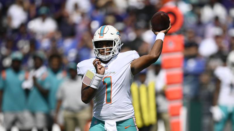 Miami Dolphins quarterback Tua Tagovailoa (1) aims a pass during the first half of an NFL football game against the Baltimore Ravens, Sunday, Sept. 18, 2022, in Baltimore. (AP Photo/Nick Wass)