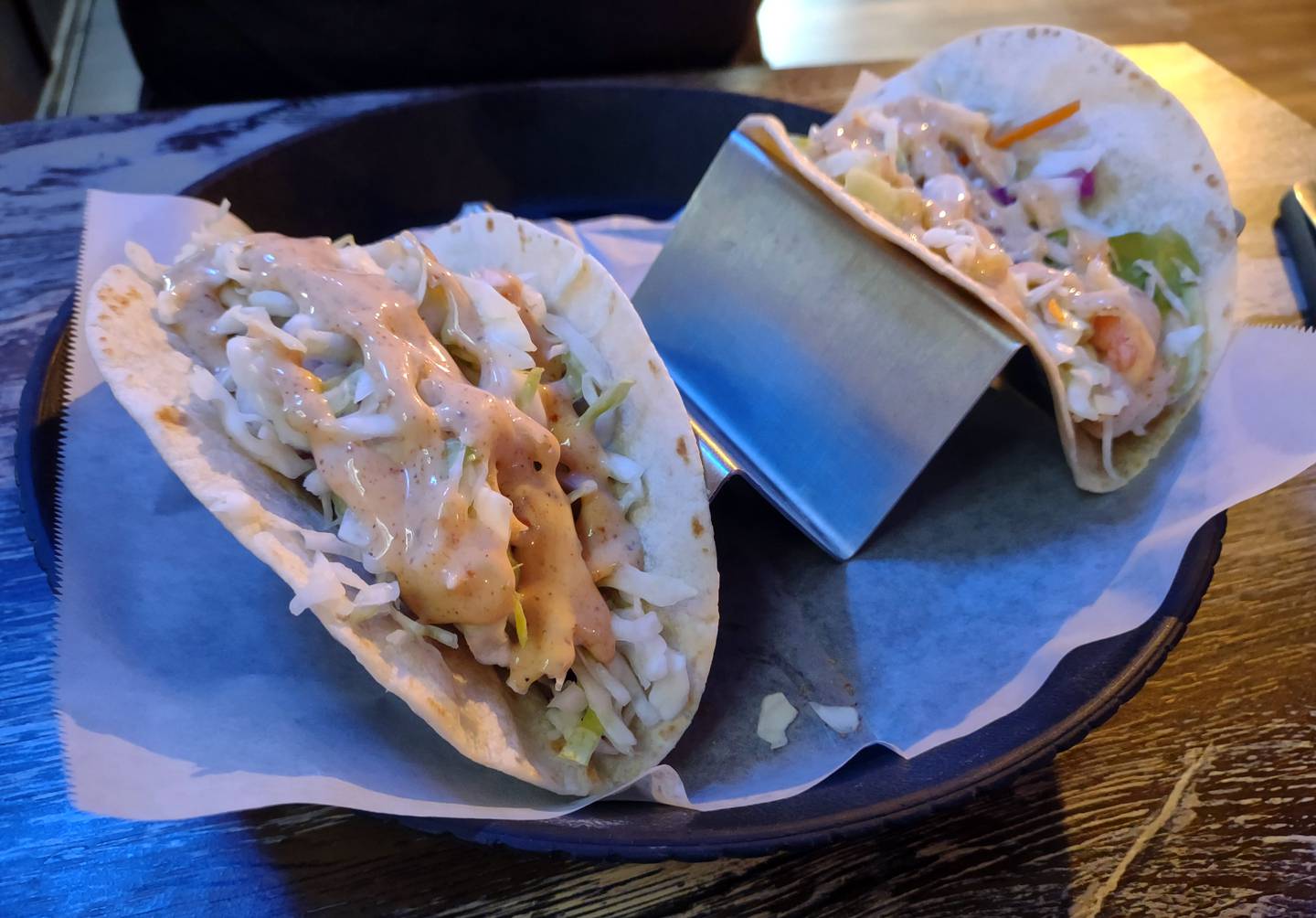 Two tacos are offered à la carte on the menu at Ziggy's Bar & Grill in downtown Marseille.  The fish taco is made with breaded Alaska pollock and a choice of ranch or Ziggy slaw.  The shrimp taco includes shrimp and ziggy salad.