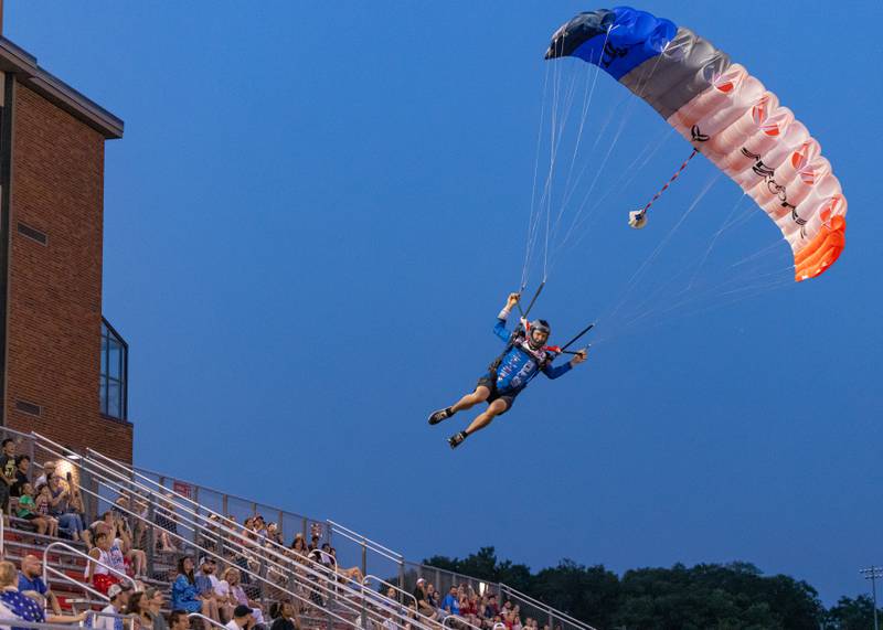 Skydiver Rook Nelson awes the crowd with his parachuting skills prior to the start of the fireworks at Bill Novak Field on July 4, 2025 at Ottawa High School.