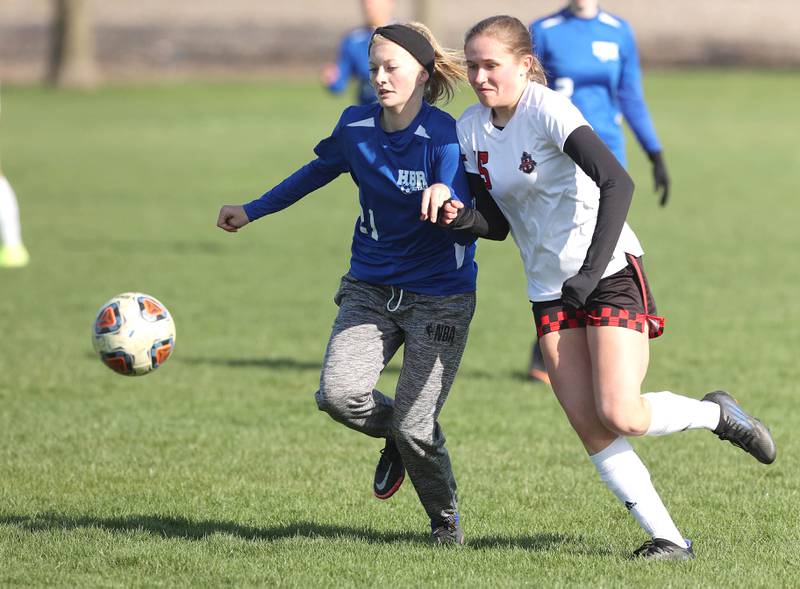 Hinckley-Big Rock/Somonauk's Brynn Gawel and Indian Creek's Alexa Anderson go after the ball during their game Tuesday, April 26, 2022, at Hinckley-Big Rock High School.