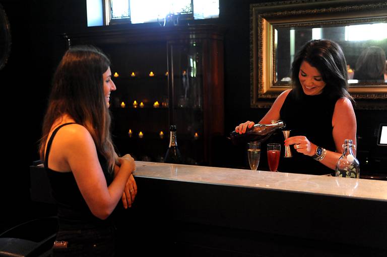 Katie Bobrow, right, makes a “Snake Charmer,” one of two signature drinks she created, for Lou’s on Friday, June 24, 2022, in Lou's in the Dole, 401 Country Club Road in Crystal Lake. The former Listening Room has been remodeled to become a speakeasy called Lou's after Eliza "Lou" Ringling. This is the 100th anniversary of Ringling's founding of the Crystal Lake Country Club. She married the eldest brother of the Ringling brothers of circus fame, Albert.