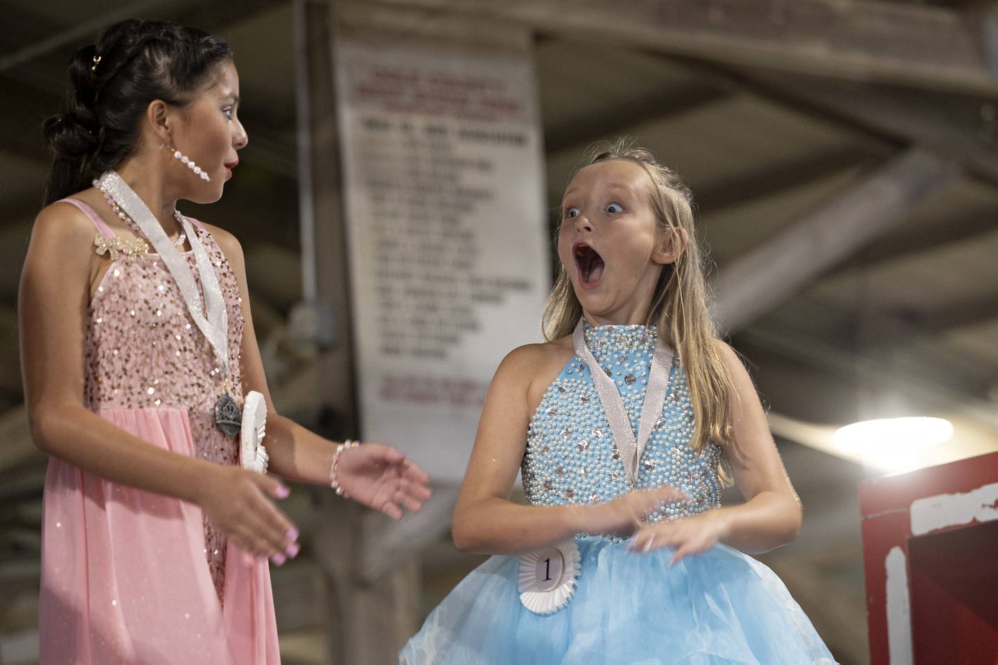 Tinley Lewis, 10, reacts to winning the Ogle County Young Miss pageant Thursday, July 30, 2025, at the Ogle County Fairgrounds.