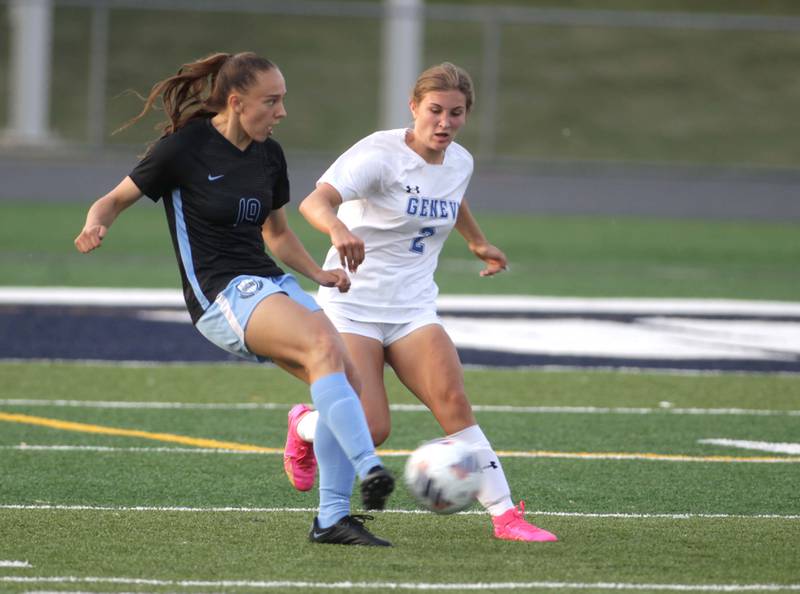 St. Charles North’s Laney Stark (left) and Geneva’s Cami Bishop go after the ball during a Class 3A West Chicago Sectional semifinal on Tuesday, May 23, 2023.