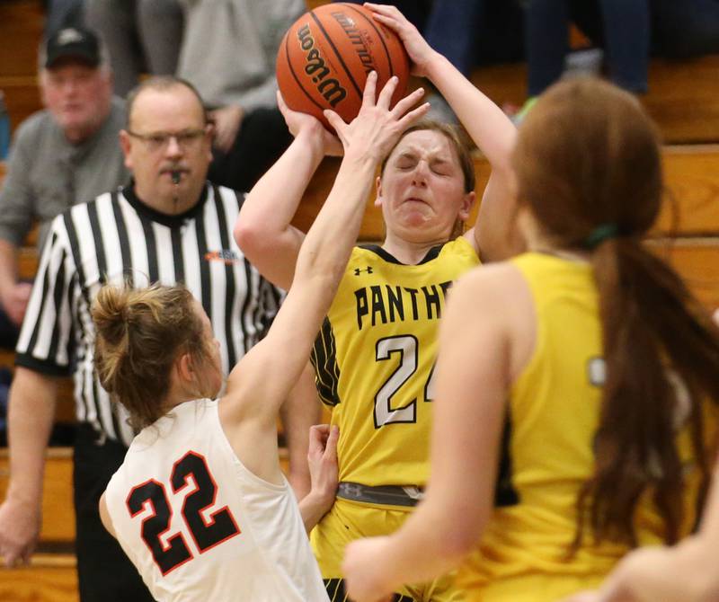 Putnam County's Gracie Ciucci is fouled by Roanoke-Benson's Brianna Harms during the Tri-County Conference Tournament on Tuesday, Jan. 17, 2023 at Midland High School.