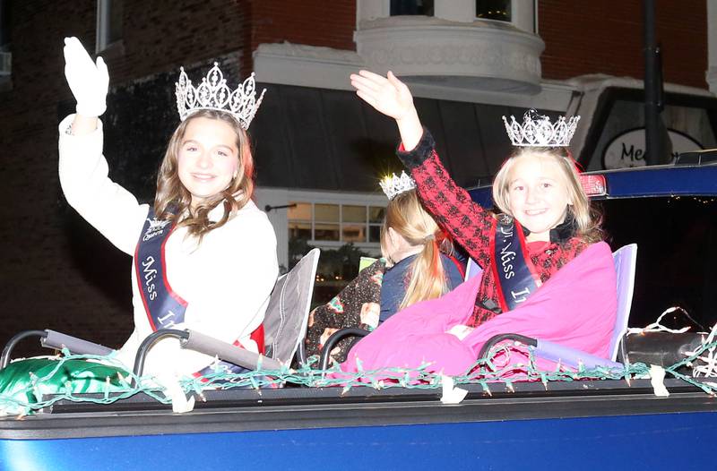 2025 Walnut's Miss Indepence Queens Little Miss Independence Karolyn Fargher, Junior Miss Independence Bristal Buske and Miss Independence Autumn Roth ride during the "Night of Lights" parade on Friday, Dec. 5, 2025 downtown Princeton. The event featured the Christmas tree lighting at Veterans Park a lighted Christmas parade down Main Street,  Living Windows, a Candy Cane Hunt, and visits with Santa.