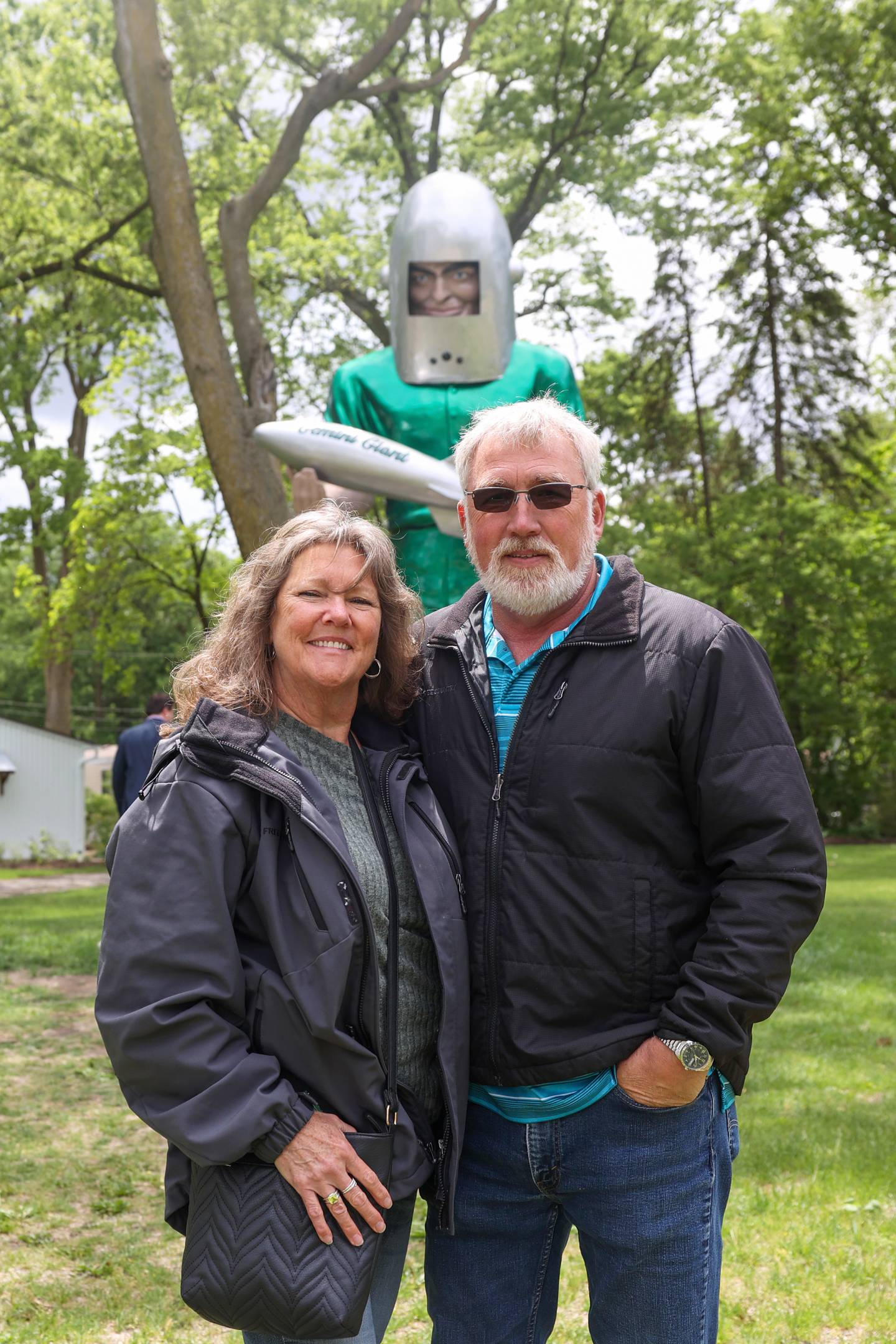 Al and Pat Bitterman, of Lemont, pose for a photo with the Gemini Giant during The Landing Pad Souvenir Shop's official ribbon-cutting ceremony at Wilmington's South Island Park on Thursday, May 22, 2025. The Bitterman's made the visit to the Route 66 event in celebration of Al's 66th birthday.