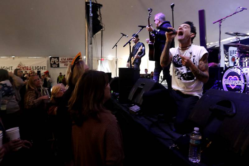 7th heaven’s Adam Heisler sings a song Wednesday afternoon, Nov. 22, 2023, during the 41st annual Turkey Testicle Festival at Parkside Pub, in Huntley. The pre-Thanksgiving festival featured live music, beer, and lots of deep-fried turkey testicles.