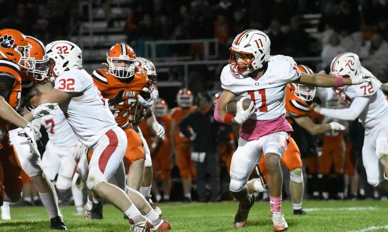 Oregon's Jayden Berry (11) looks for a gap in the line as he runs with the ball during 3A football playoff action against Byron on Friday, Oct. 31, 2025 at the Everett Stine Stadium in Byron.