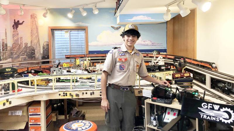 George Werderich with the train set he and his father built in the basement of his home.
