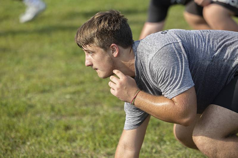 The Morrison football team goes through workouts during a camp Tuesday, July 25, 2023. The Mustangs will open their season against Mendota at the end of August.