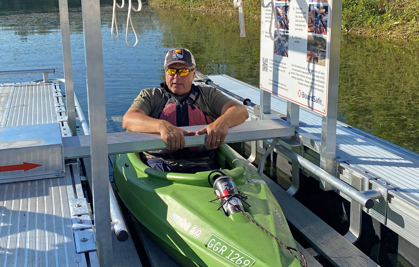 Adaptive recreationalist Bill Bogdan of Mokena tests out the new kayak/canoe launch at Lake Chaminwood Preserve near Channahon. The accessible device was installed recently by the Forest Preserve District of Will County to help people of all abilities enter and exit the water independently.